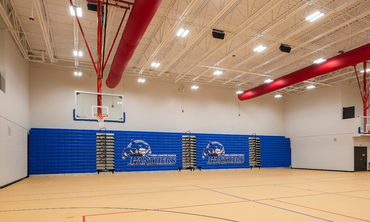 Indoor basketball court with padded gym walls
