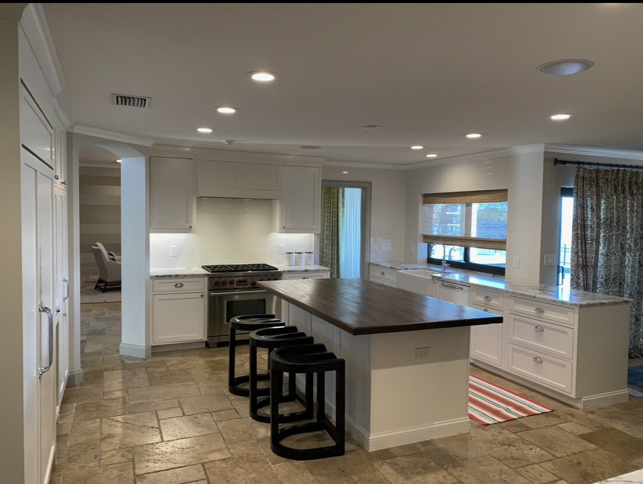 Open-plan kitchen with island and recessed lighting