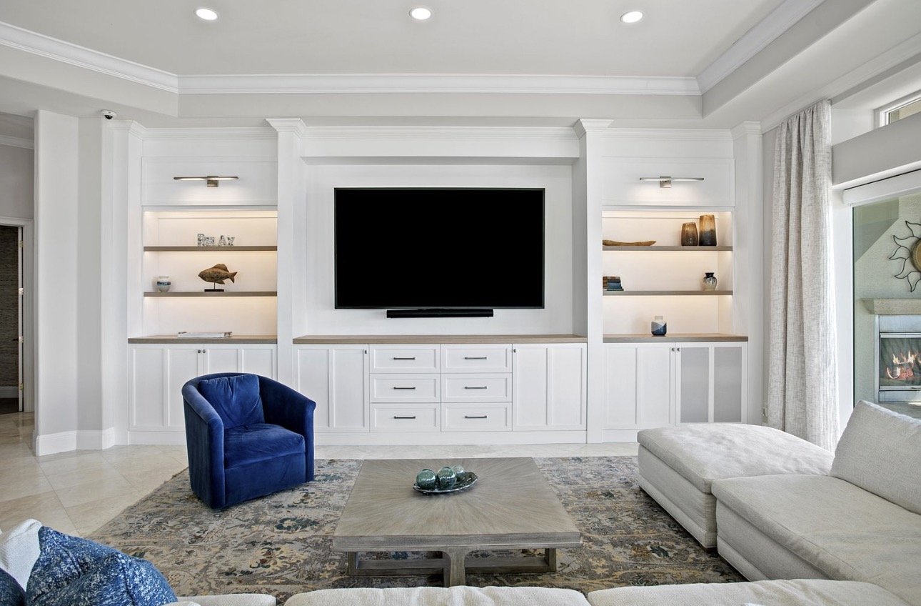 Living room with built-in media wall and display shelves