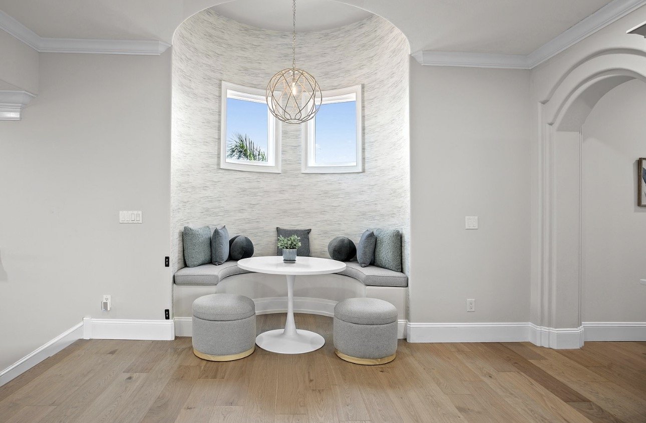 Window seating alcove with upholstered stools