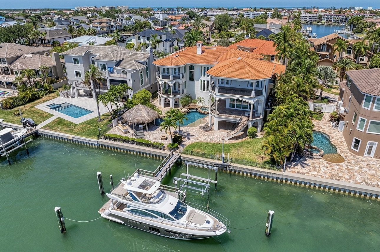Waterfront home with private dock and boat