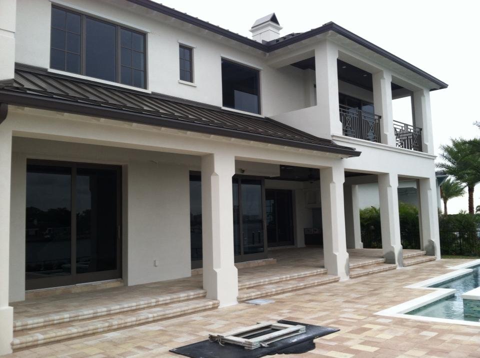 Two-story home with balcony and pool terrace