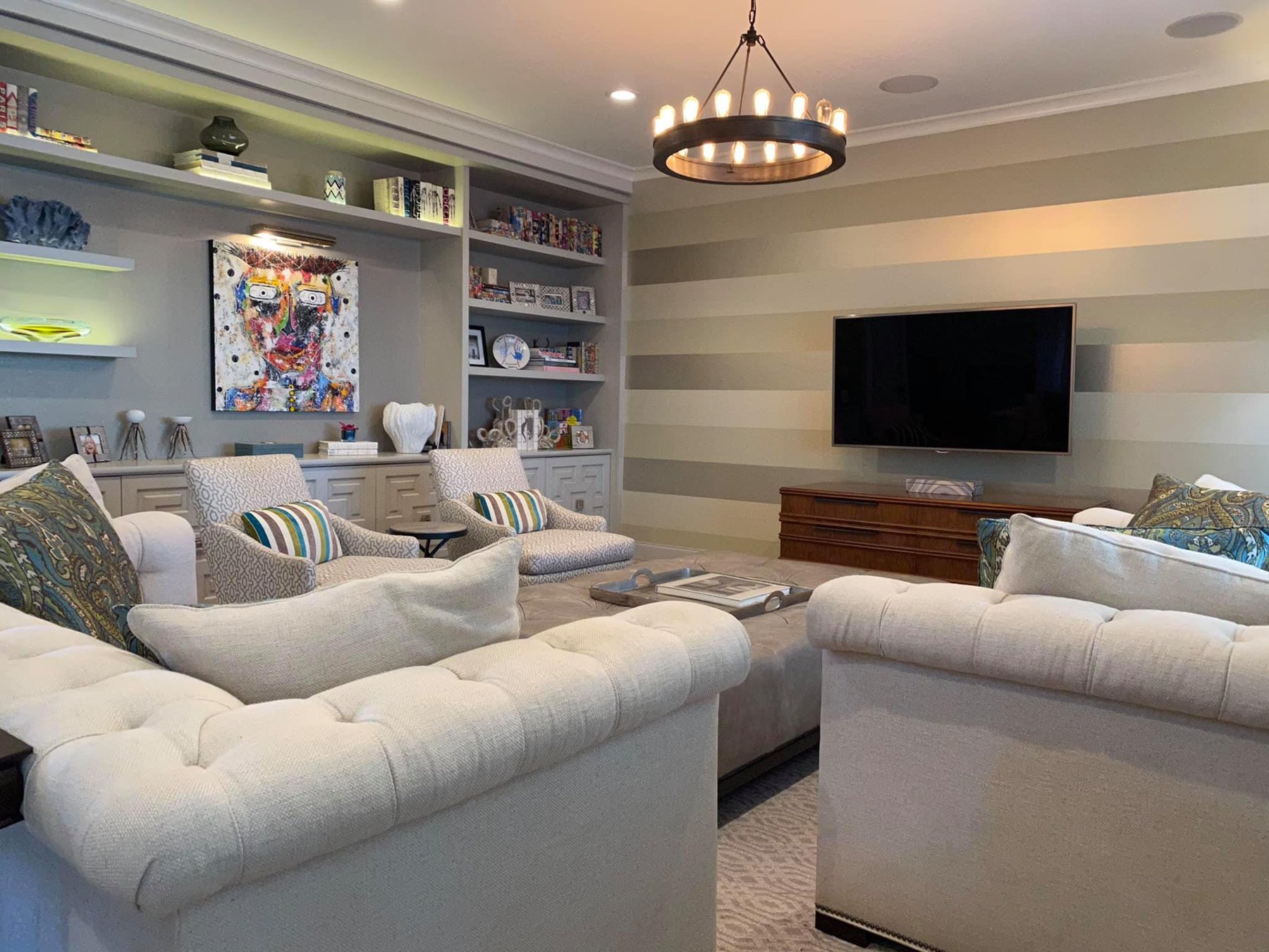 Living room with built-in shelving and sectional seating