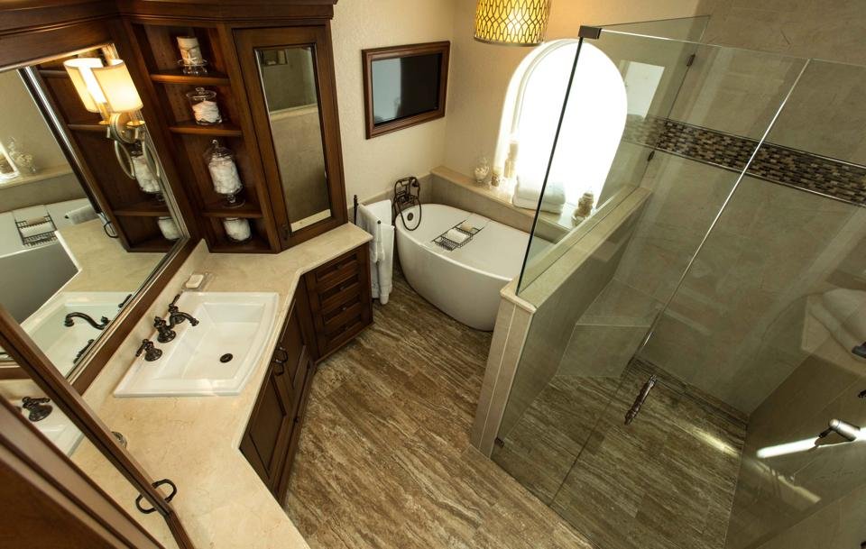 Bathroom with glass shower and stone vanity